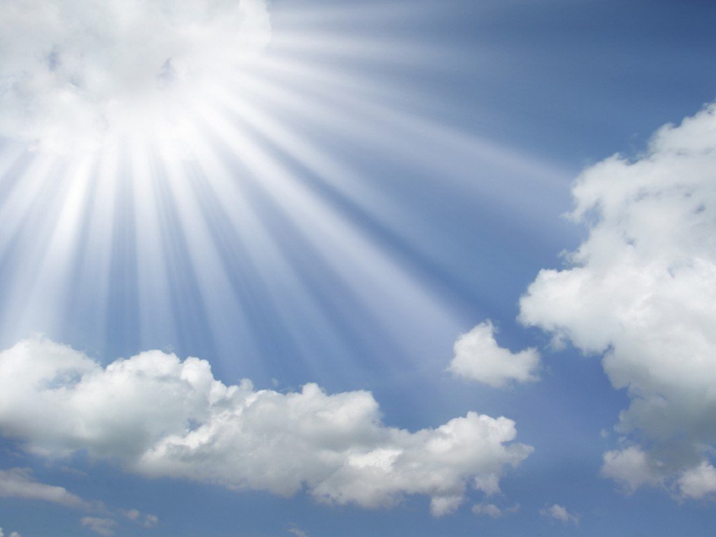 sun-rays-coming-out-of-the-clouds-in-a-blue-sky-wallpaper