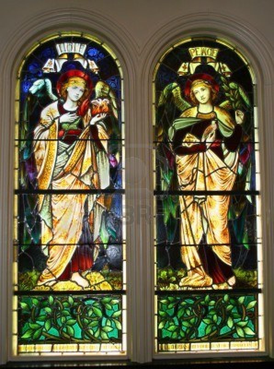 3303345-a-pair-of-old-stained-glass-windows-circa-1899-showing-two-angels-labeled-as-and-peace
